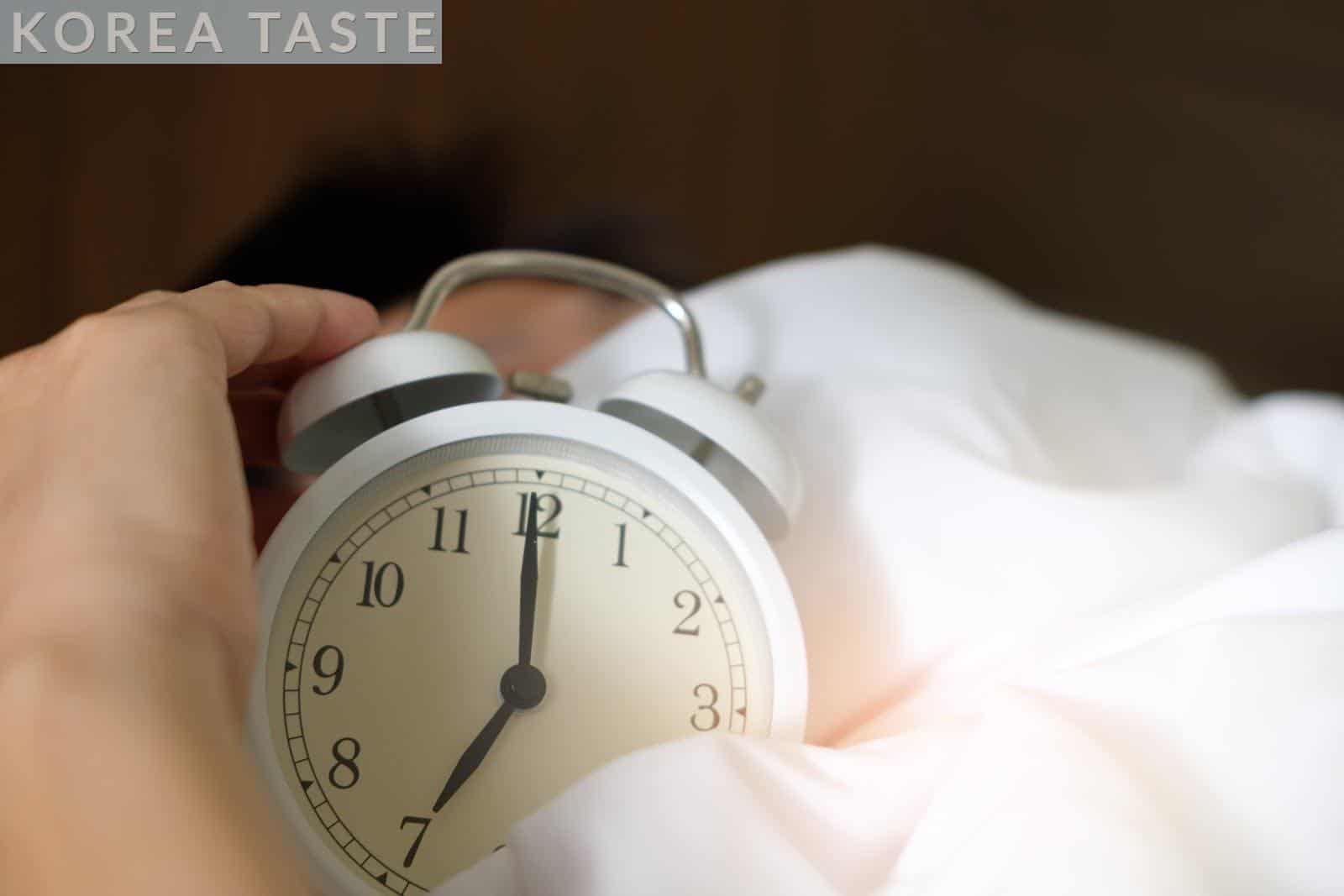 Photo of Person Holding Alarm Clock