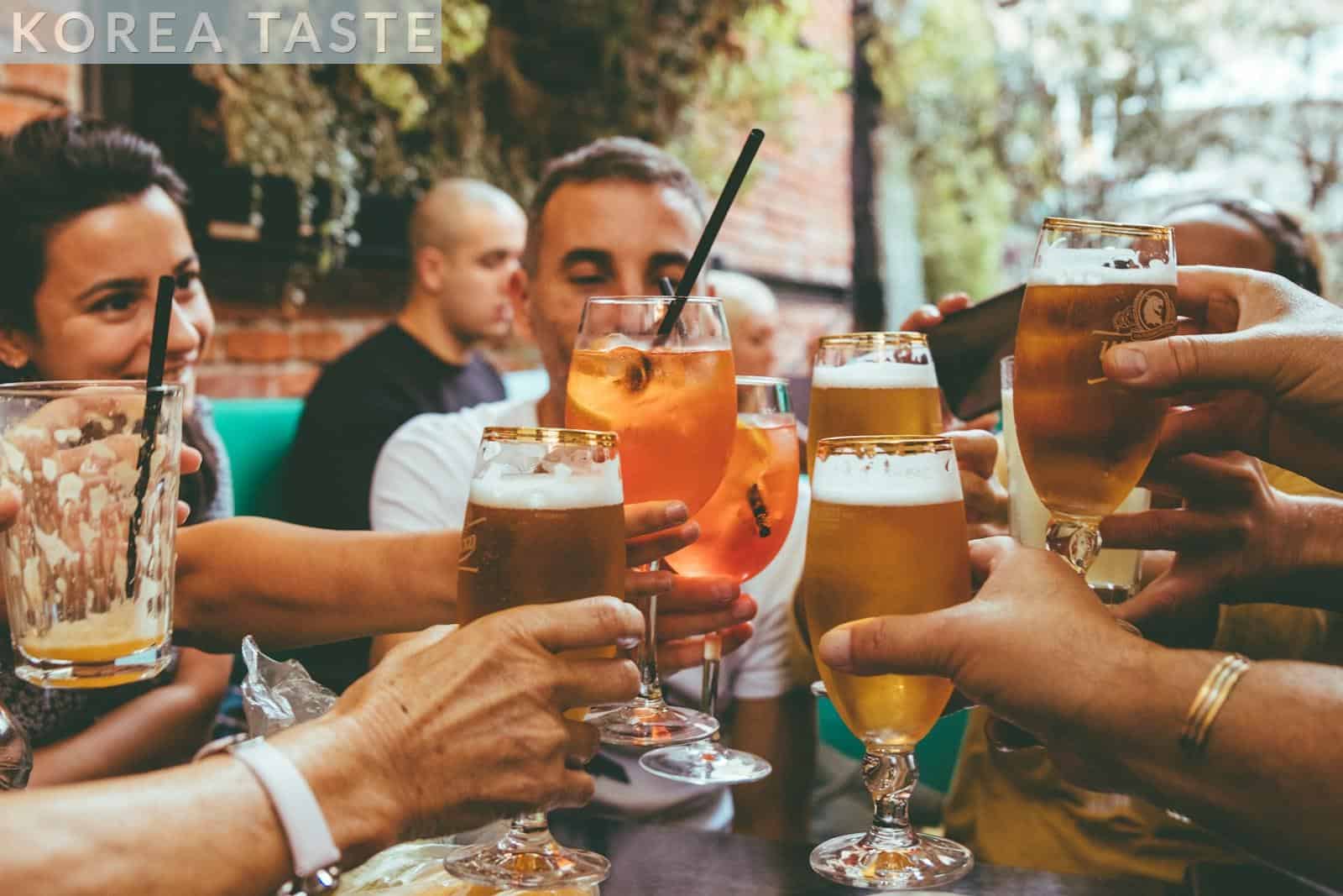 people holding drinks during day