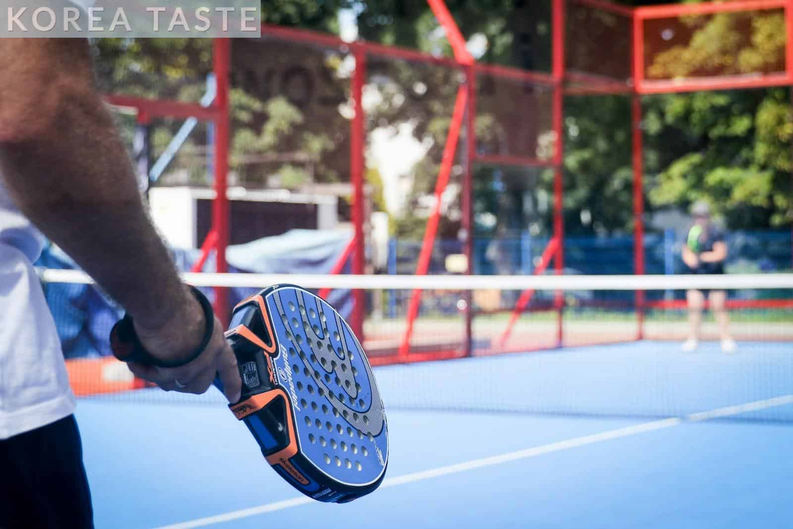 person wearing blue and white sneakers