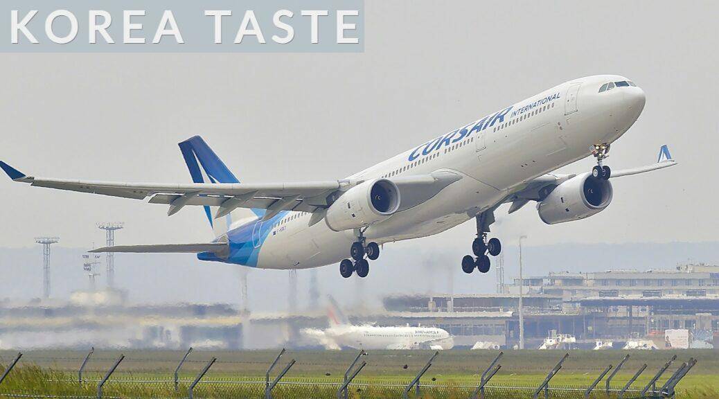 white and blue airplane about to fly at the airport